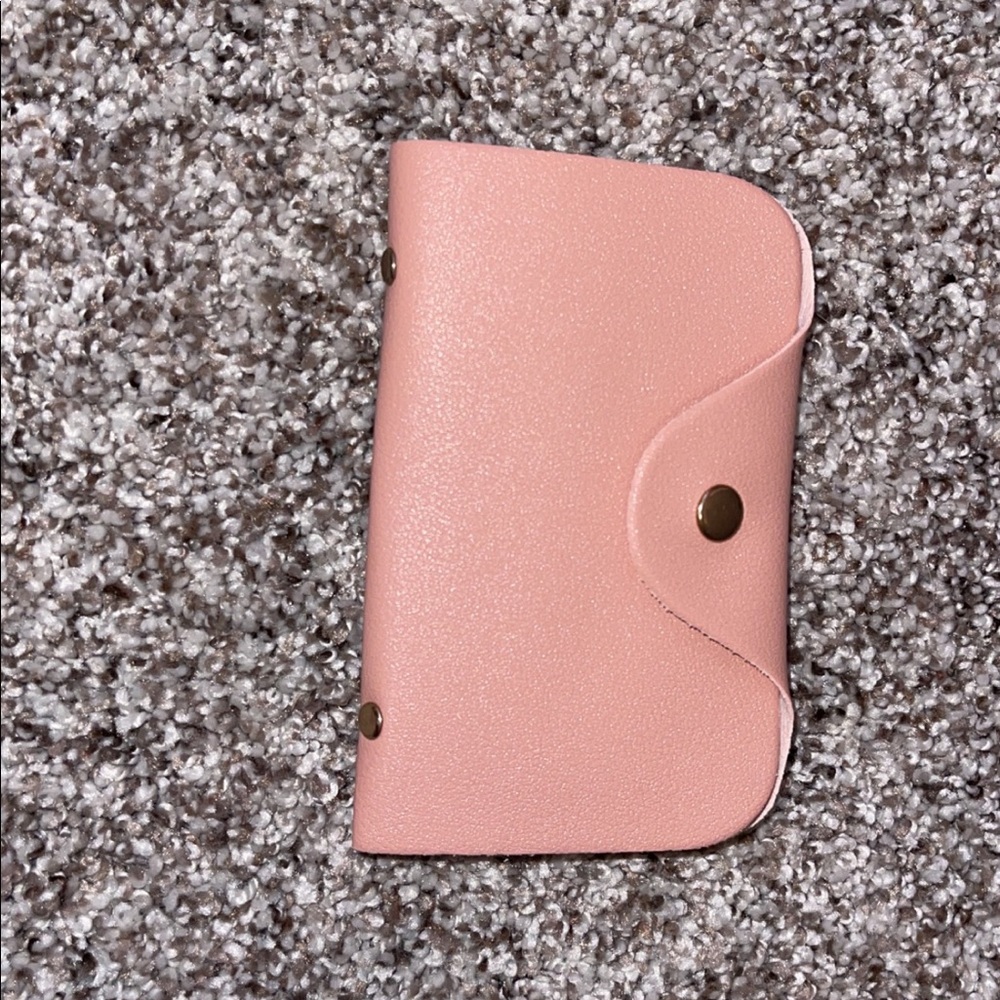 Pink purse with accessories